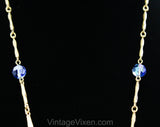 Victorian Revival Pendant Necklace - Bold Blue Antique Style Gold Hue Metal Medallion - Faceted Glass Rhinestones & Filigree - 1970s Retro