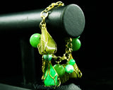 Terrific 1960s Green Charm Bracelet - Cage Style Beads & Jade Plastic Baubles - Goldtone Metal - Secretary Style - Chunky Metal 60s Fad