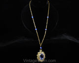 Victorian Revival Pendant Necklace - Bold Blue Antique Style Gold Hue Metal Medallion - Faceted Glass Rhinestones & Filigree - 1970s Retro