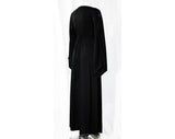 Size 6 Hippie Black Dress - Bohemian 70s Polyester Knit with Peek A Boo Bare Midriff Waist Medallion - Slit Long Angel Sleeve - Bust 33.5