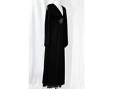 Size 6 Hippie Black Dress - Bohemian 70s Polyester Knit with Peek A Boo Bare Midriff Waist Medallion - Slit Long Angel Sleeve - Bust 33.5