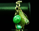 Terrific 1960s Green Charm Bracelet - Cage Style Beads & Jade Plastic Baubles - Goldtone Metal - Secretary Style - Chunky Metal 60s Fad